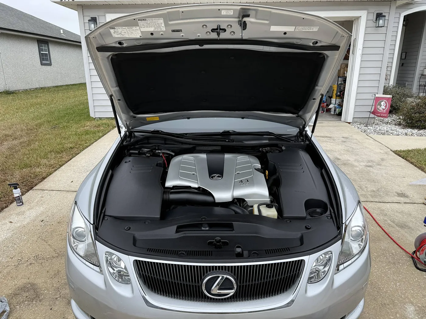 Spotless Lexus GS engine bay after an engine detail by Sud Titan in Jacksonville