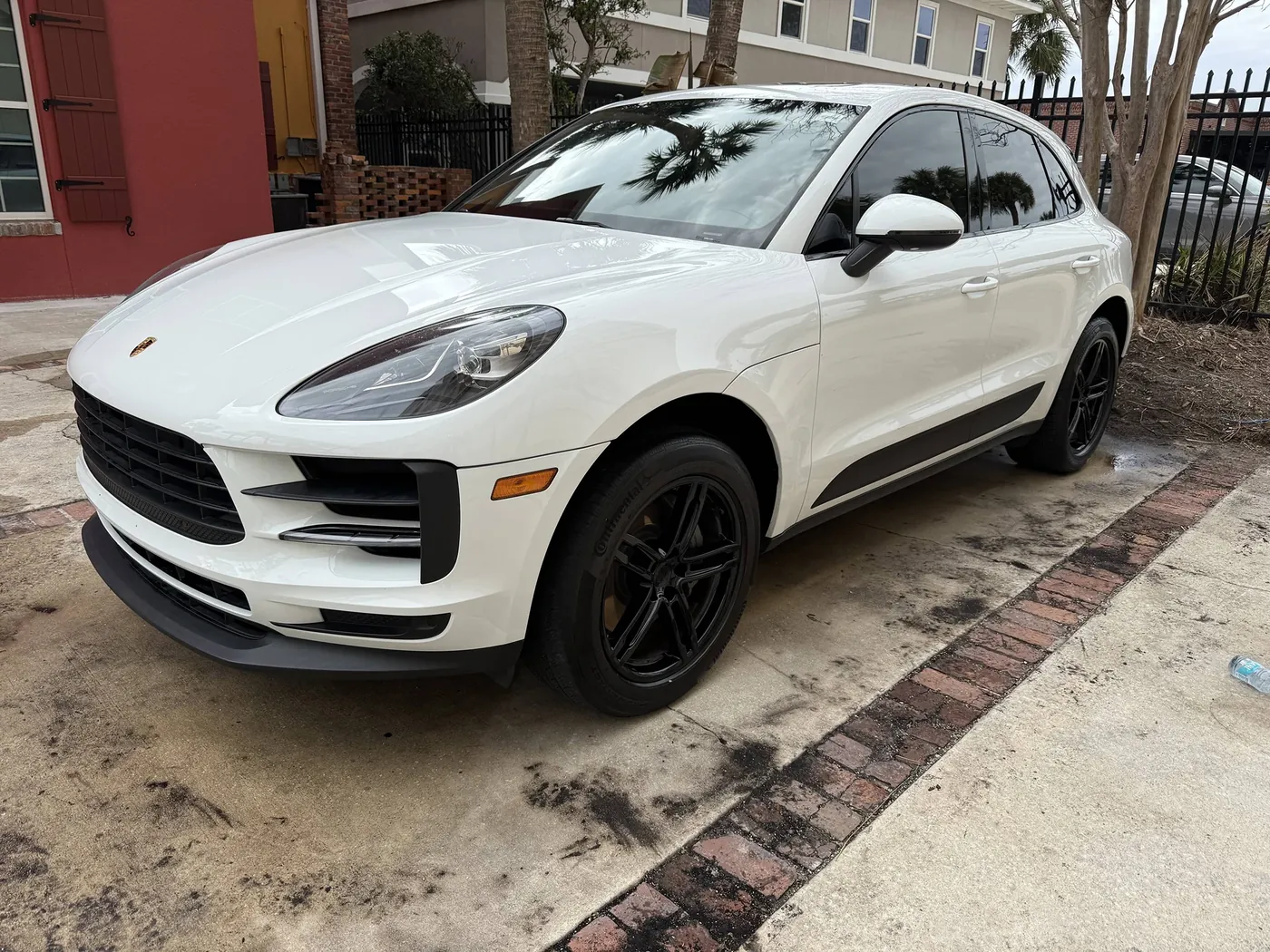 White Porsche Macan with glossy paint after a Sud Titan mobile detail in Jacksonville