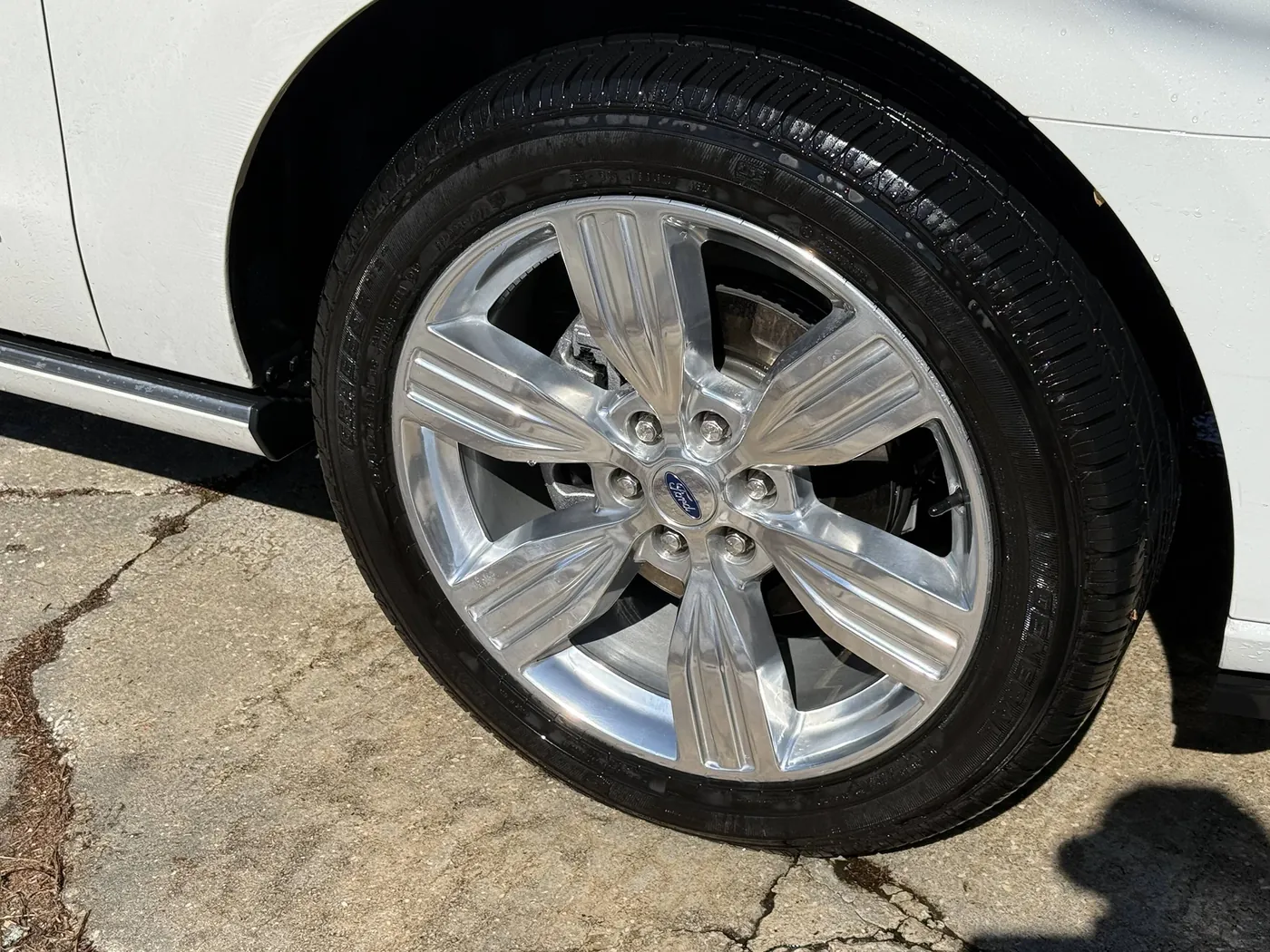 Polished Ford wheel and dressed tire after a wheel and tire detail in Jacksonville